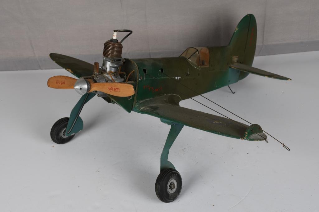 Gas Engine Power Wood Body Tether Airplane: rated 7.5, 24" wingspan, the balsaÃ‚ wood body is in good condition, has soling and wear, has a Syncro ACE gas engine that is free.