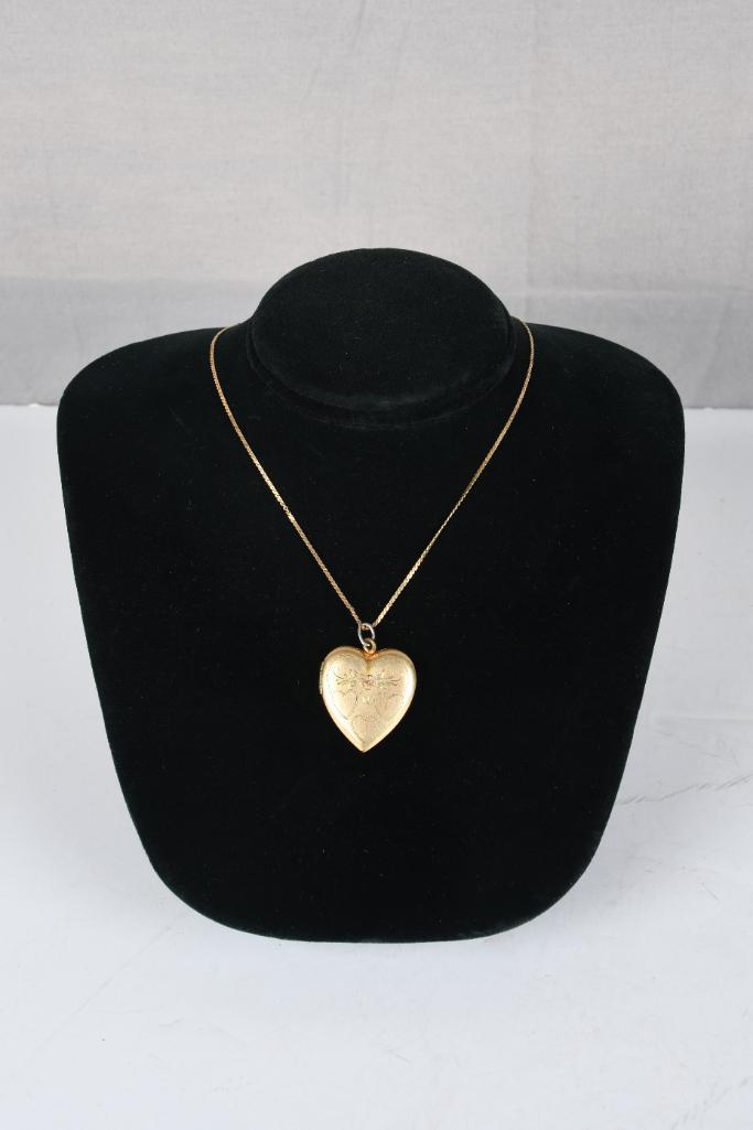 Gold Filled Heart Locket on 14KT Gold Chain 18": GF heart locket with 32 hearts engraved on the front. Locket is on a 14kt gold 18" chain. In good condition.