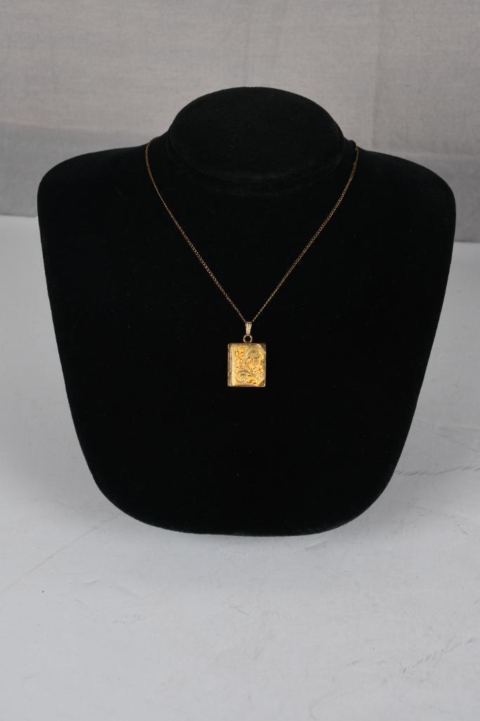 Gold Filled Locket on a 15" GF chain: Gold filled book locket is etched on the front. Locket is on a 15" GF chain. In good condition.