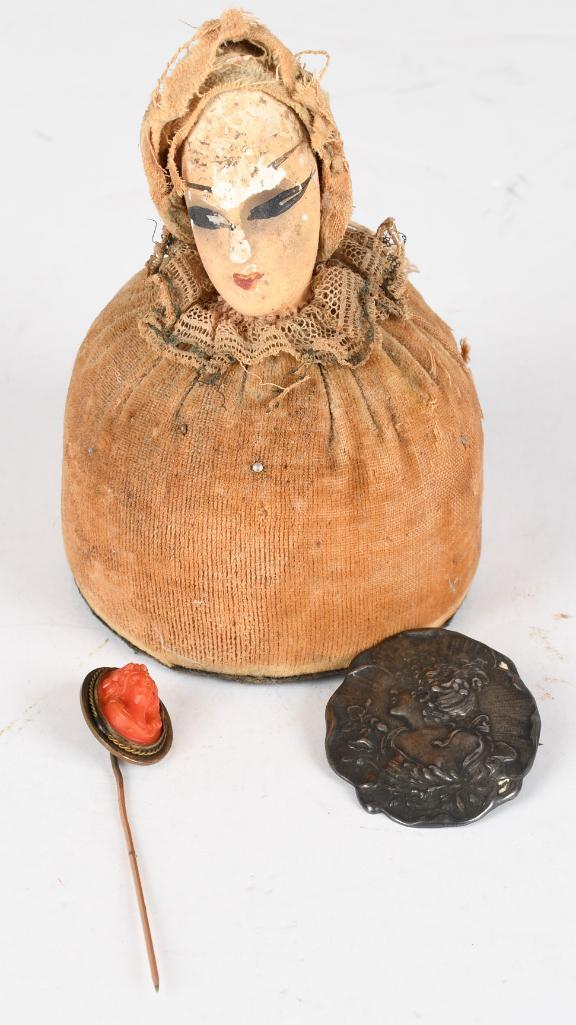 Lot of 3- Pin Cushion, Cameo Stick Pin, & Art Nouveau: Pin cushion with a womans head on top. Carved Shell cameo on a stick pin. An Art Nouveau lady brooch. Pin cushion has some wear, others in good condition.