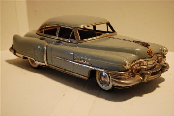 1950's Cadillac Four Door Japanese tin litho fric: 1950's Cadillac Four Door Japanese tin litho friction Car, 12.5 inches long,