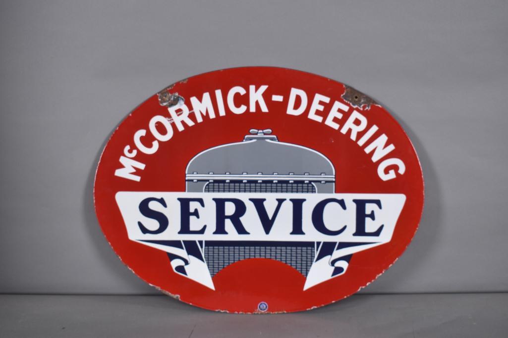 McCormick-Deering Service w/Radiator Logo Porcelain: Rated 8.75, 24"x31.5", DSP oval sign has excellent color and gloss, fields are clean, has large chips at the mounting holes, tiny chips along the bottom edge. The Authentication Company #008440