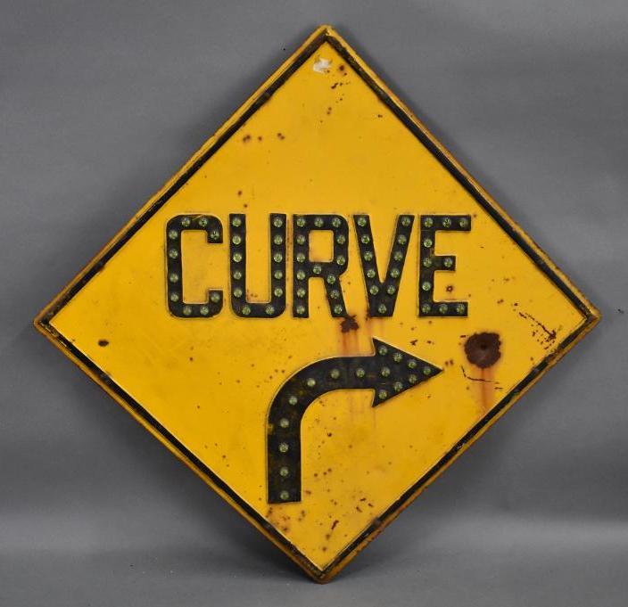 Curve Road Sign w/Glass Jewels Metal Sign: rated 7.5, 34"x34", SST embossed sign with green glass jewels, has rust spots and wear, has all of it's jewels.