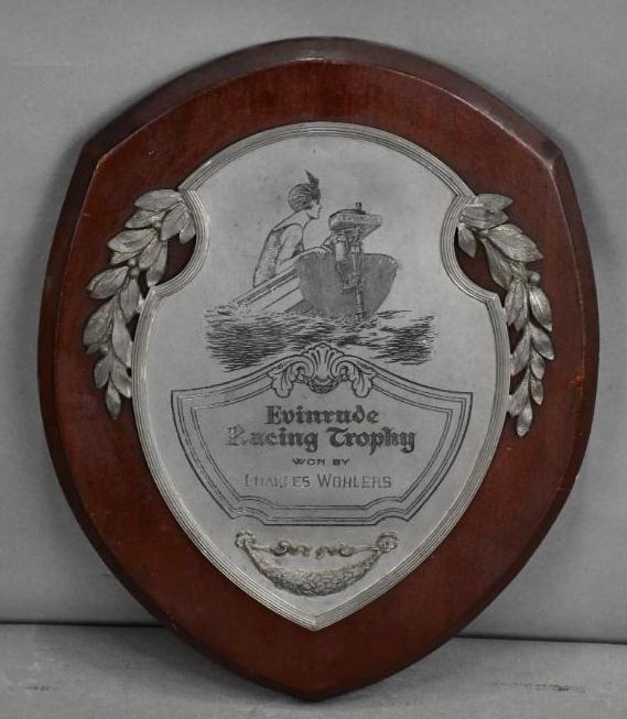 Evinrude Racing Trophy w/Early Graphic Engraved: Rated 8, 14.5"x12", the metal plaque is mounted on a wood base, is in good condition.