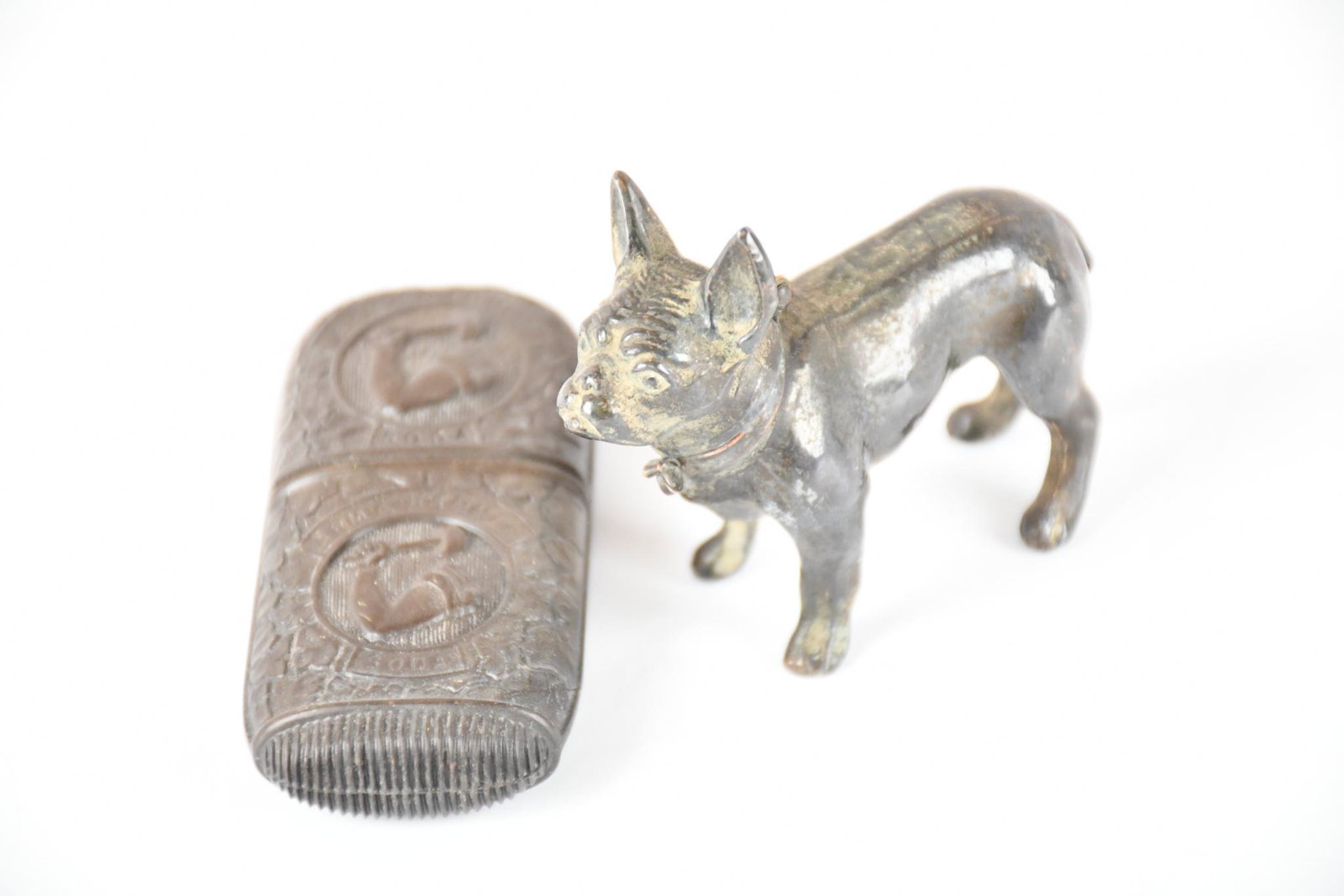Arm & Hammer Plastic Match Safe & Boxer Cigarette Lighter: match safe is in good condition, boxer is in poor condition.