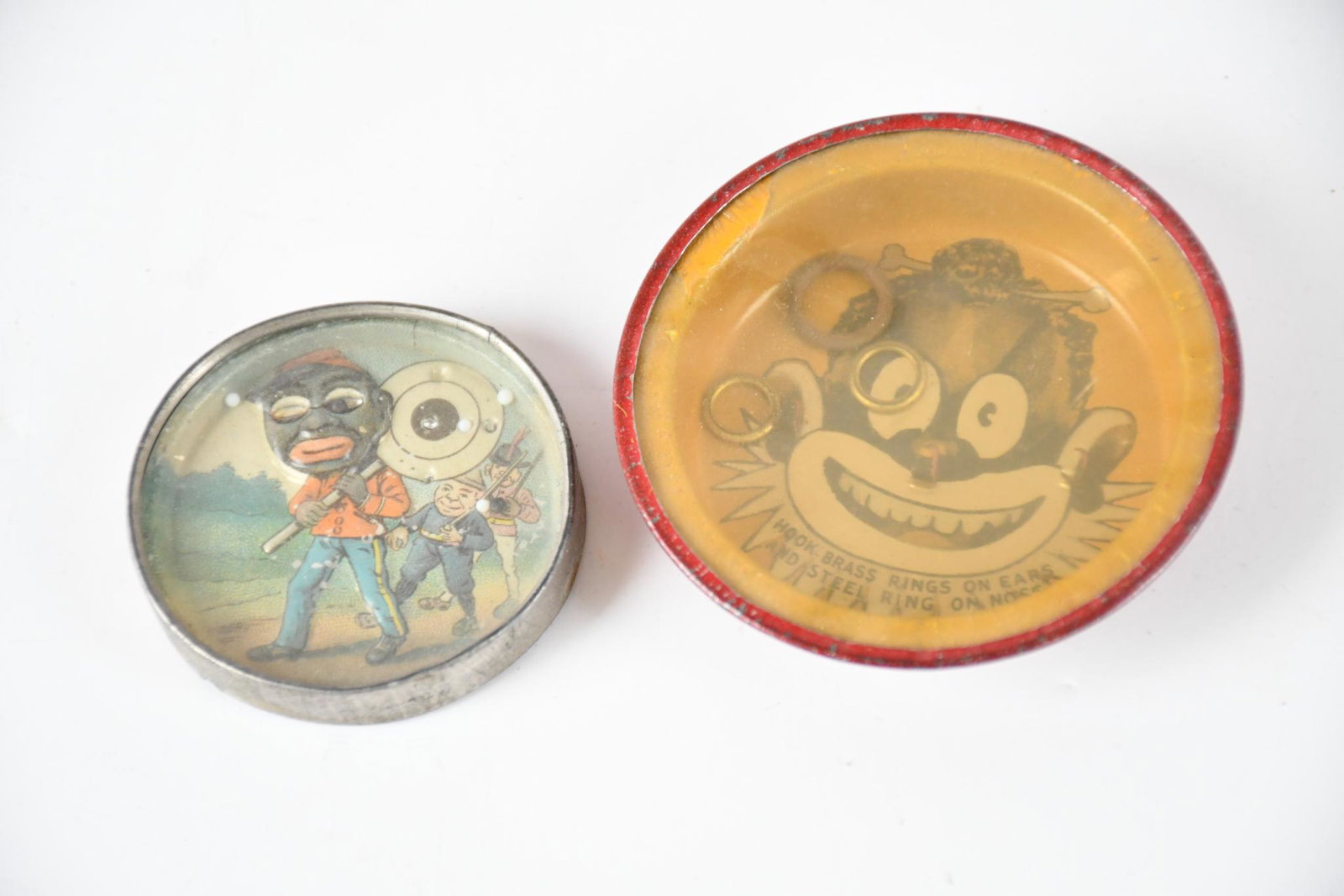 2-Black Memorabilia Games: both have light wear, both are complete.2.5" in diameter or less.
