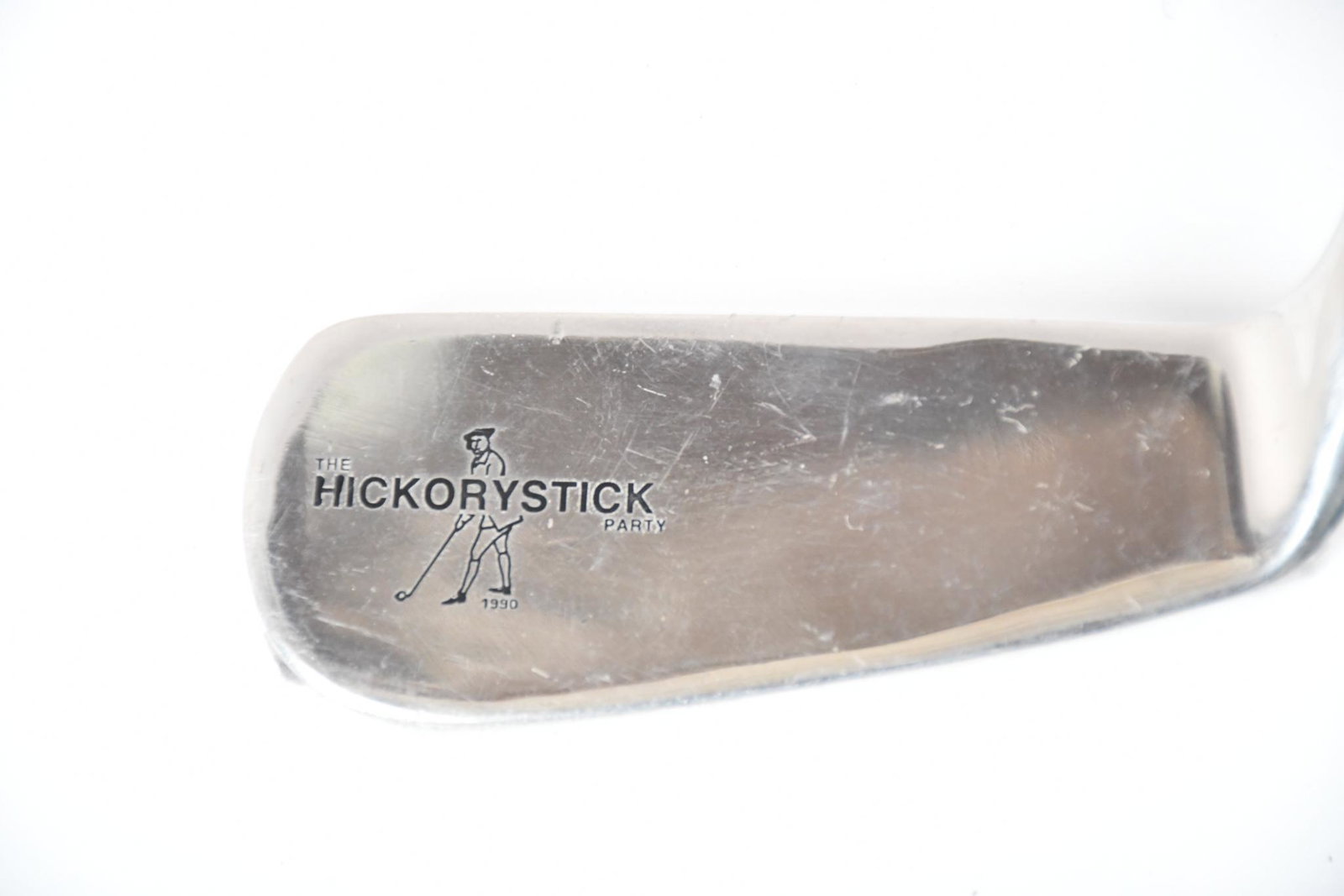The Hickorystick Party Calamity Jane Golf Putter: rated 9, 35.75"L., has a chromed putter head with very light wear, hickory shaft, leather grip is in good condition.