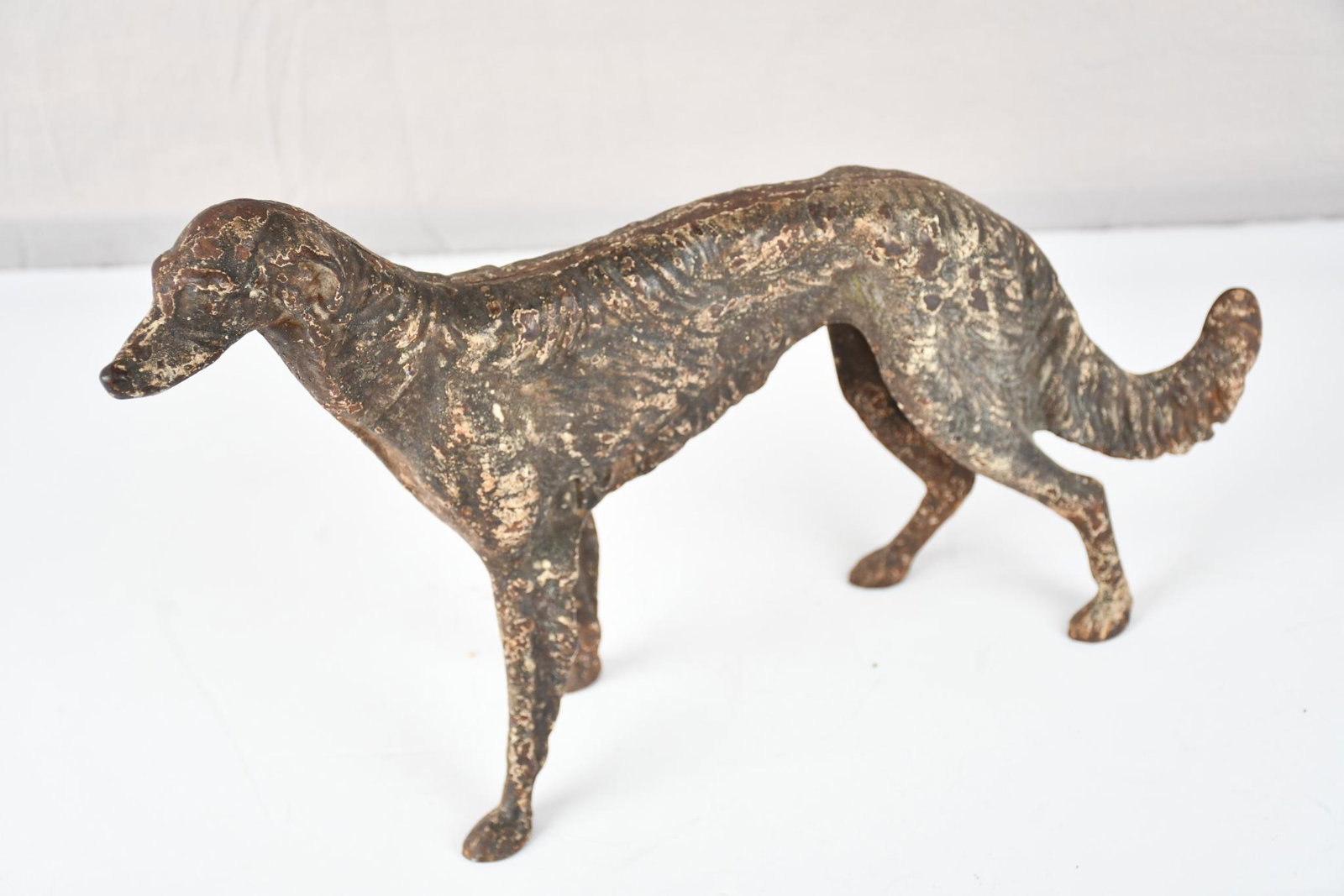 Afghanistan Hound Cast Iron Door Stop: rated 7.5, 9.5"H., has wear and soiling, is original.