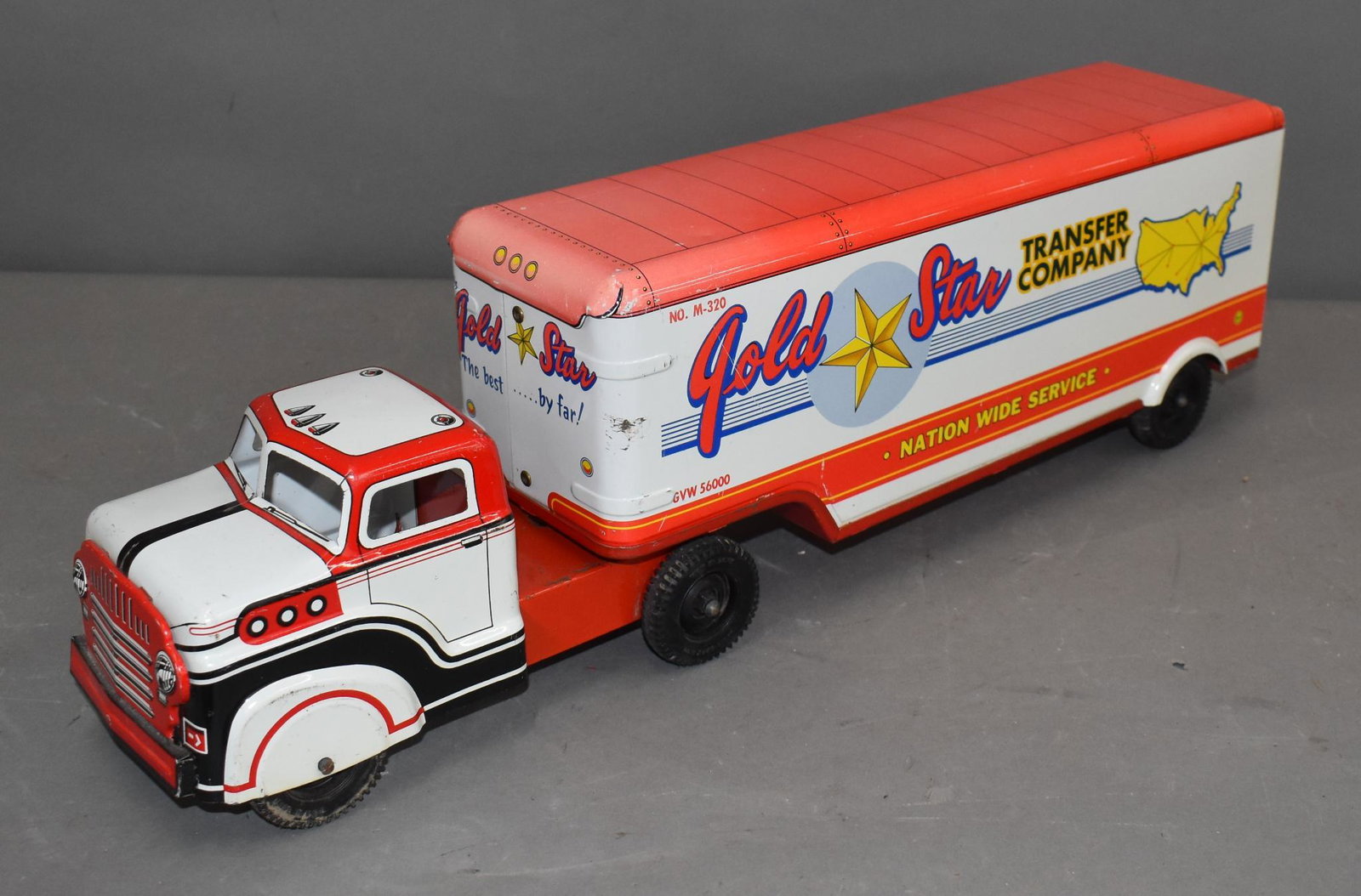 Marx Tin Litho Gold Star Transfer Company Semi & Trailer: rated 8, 21"L., tin litho semi and trailer has good color and shine, is slightly faded on the front of the trailer.