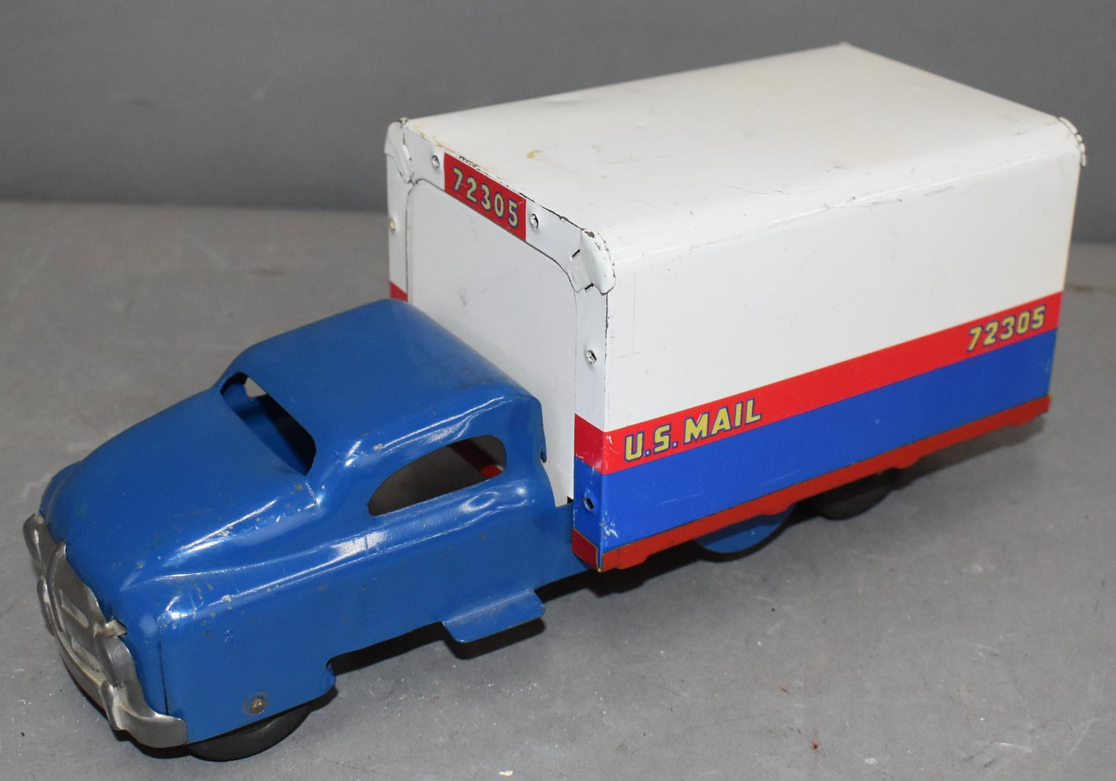 Marx? Press Steel U.S. Mail Truck: rated 8, 10.5"L., press steel truck has good color and shine has light wear and fins scratches, has rubber wheels.