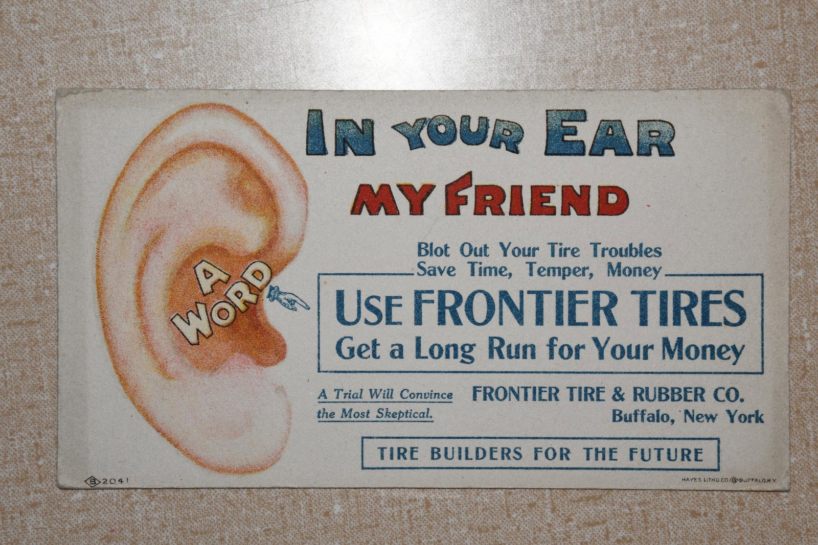 Frontier Tire & Rubber Co. Ink Blotter: Measures 6.25"L x 3.5"H. Blotter is in good condition with wear around the edge. Has great graphics. Marked Hayes Litho Co. Buffalo NY.