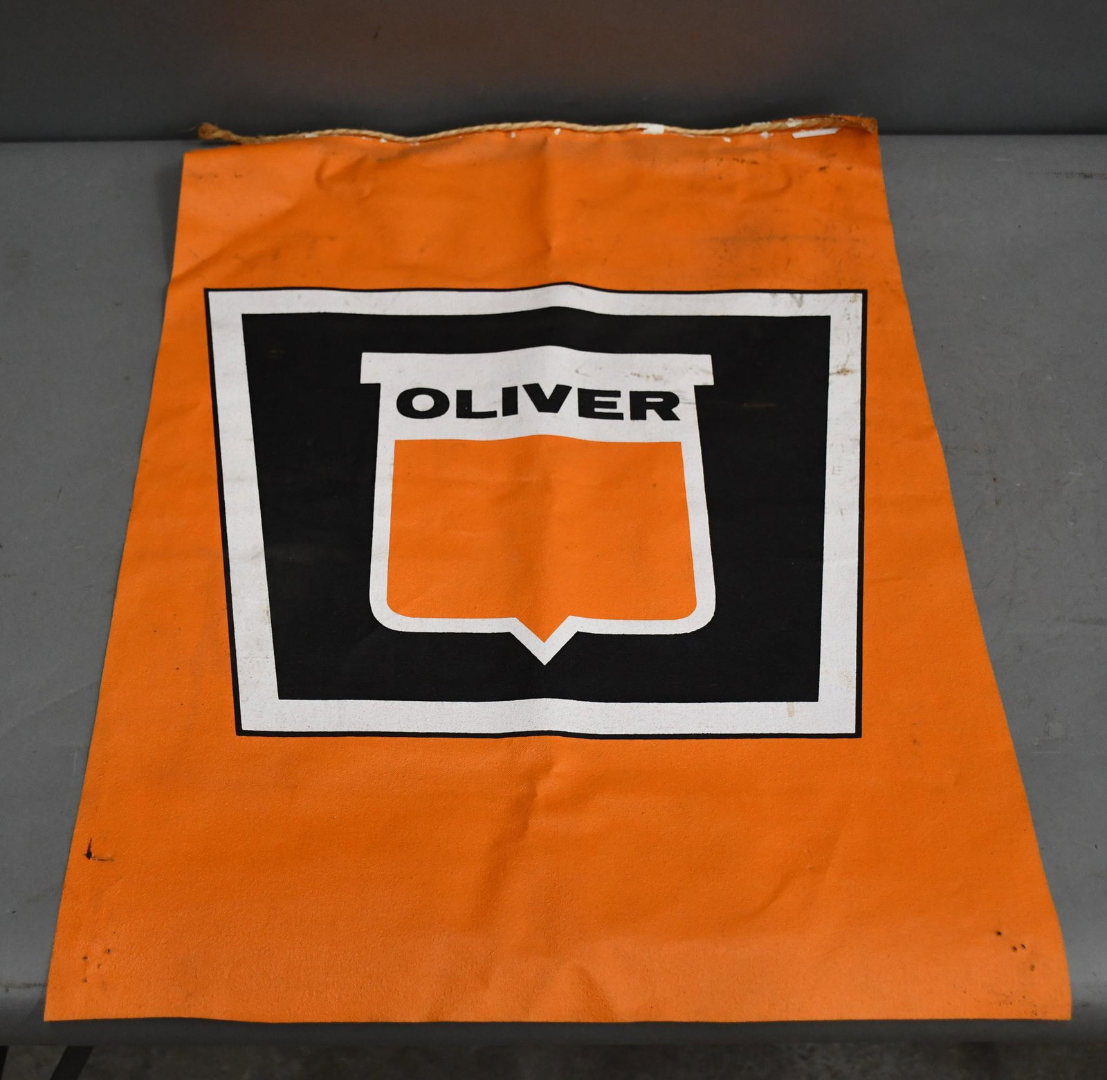 Oliver Keystone Logo Canvas Flag: rated 8, 24"x18", has good color, light soiling, a few nail holes around the perimeter.
