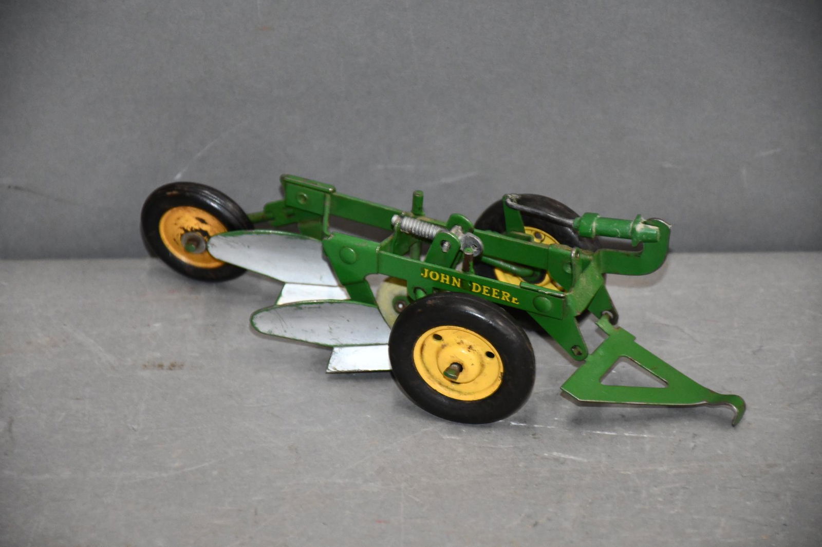 Eska Two-Bottom John Deere Hitch Plow: rated 8.9, 8"L., has good color, has light wear, has metal front rims, rubber rear.