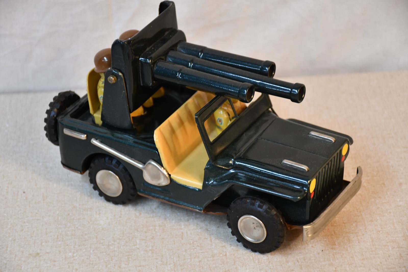Anti-Aircraft Jeep Japanese Tin-Litho Fiction Drive Toy NIB: rated 9.5, 7.5L., has excellent color and shine, motor works good, box is rated 5.5 has good color, has creases, wear and edge damage.
