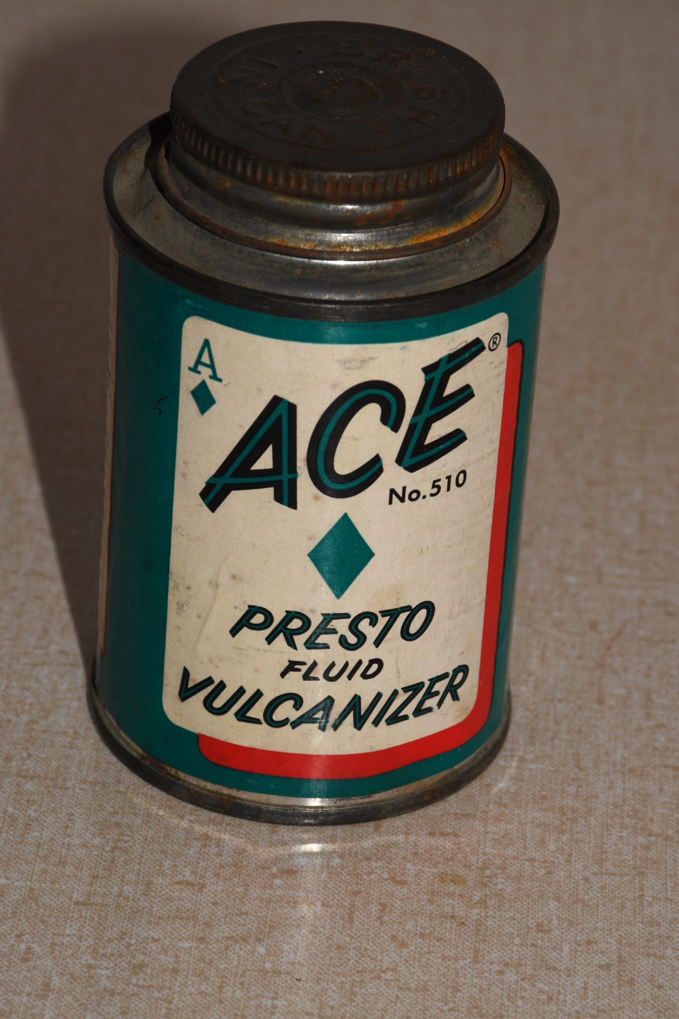 ACE Presto Fluid Vulcanizer Metal Can: rated 7.75, 4"T., metal can with a paper label, light wear, is empty.