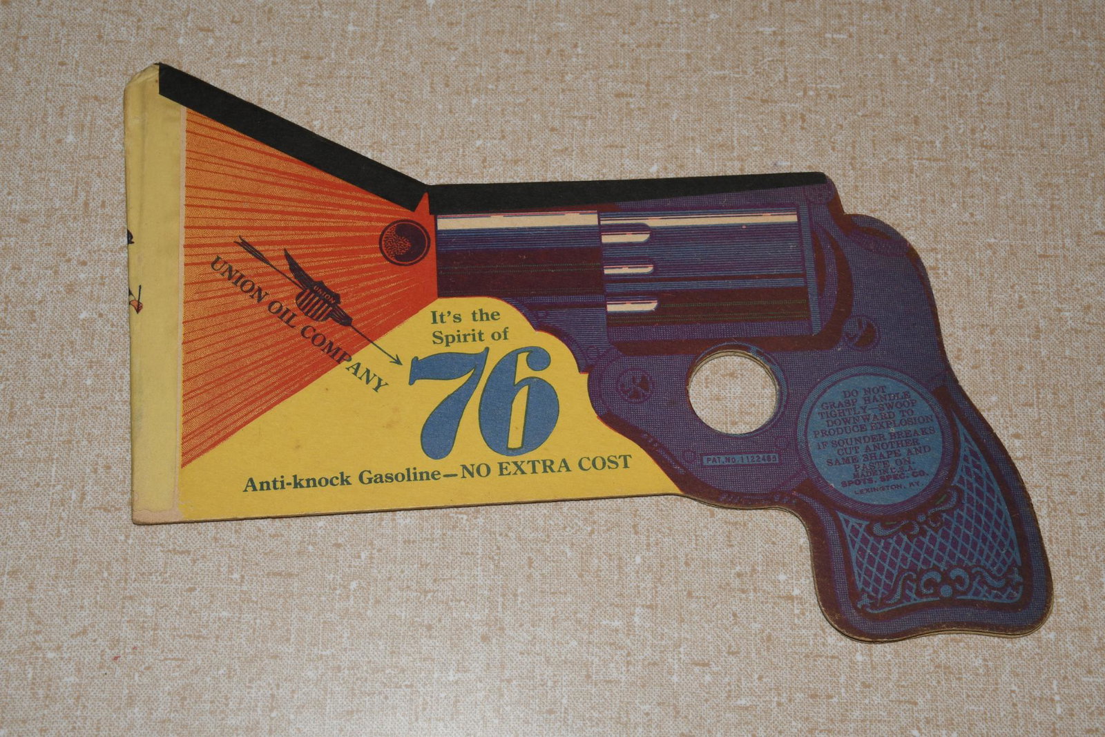 Union Oil Company "Anti-Knock Gasoline Paper Play Gun: rated 8.5, 6"x8", is in good condition, has good color.