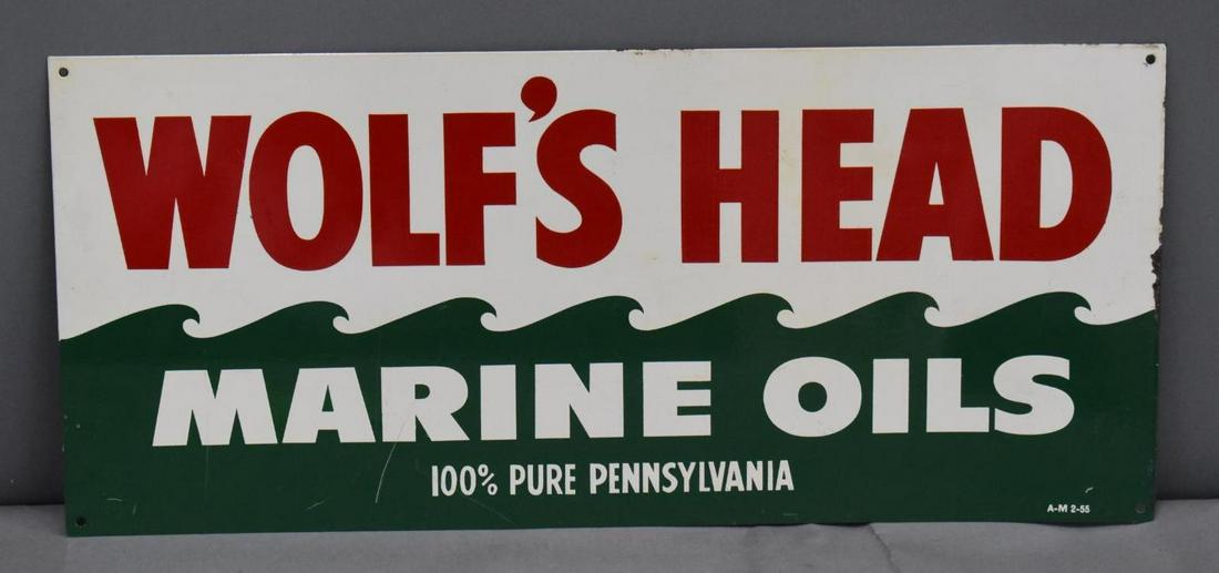 Wolf's Head Marine Oils Metal Sign (TAC): rated 9, 8"x18", SST sign has excellent color and shine, field is clean, has wear around the perimeter, marked A-M, dated 1955. TAC #039411