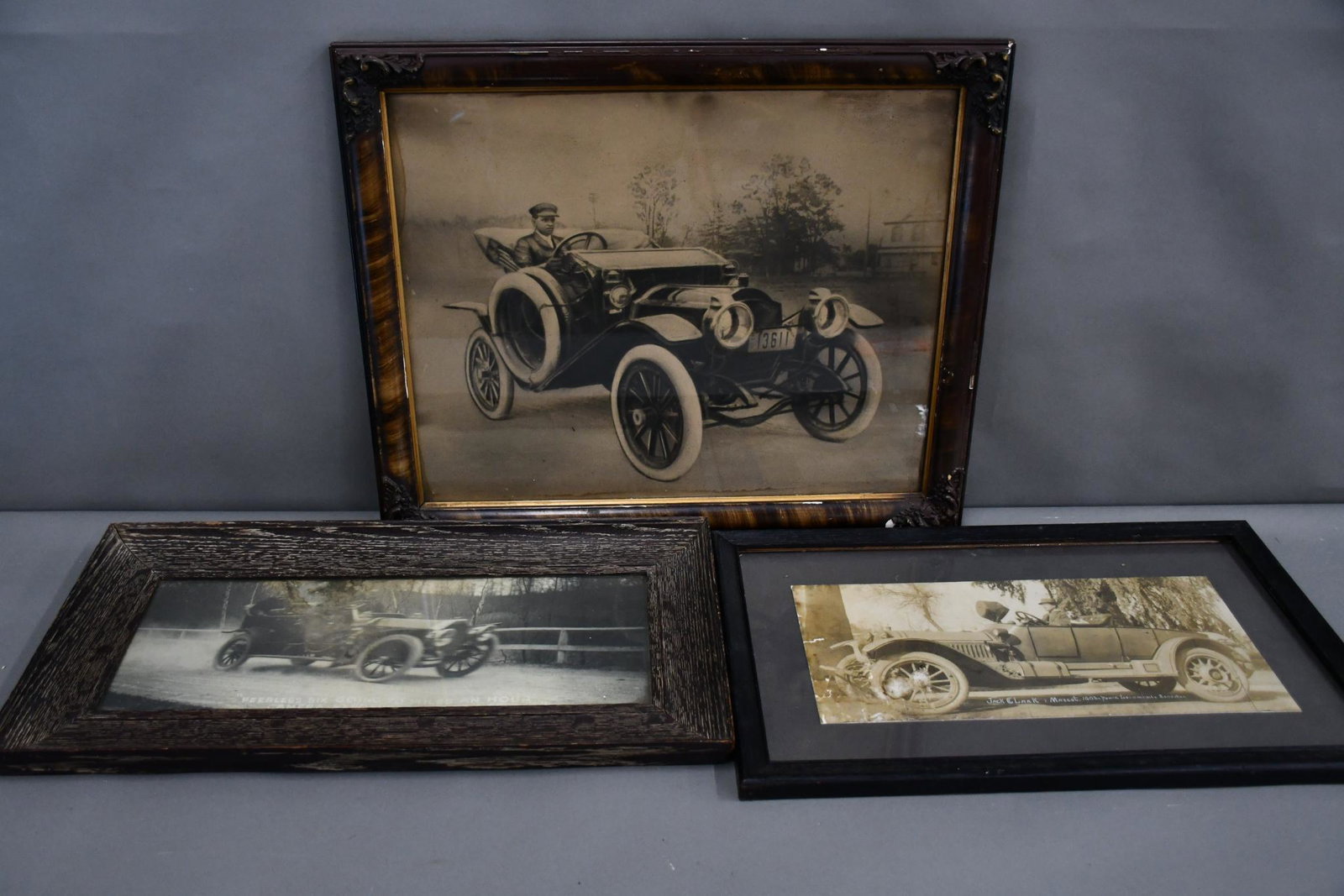 3-Automobiles Photographs: rated 5 to 7, 19"x23" or less in size, all are framed under glass, two have damage.