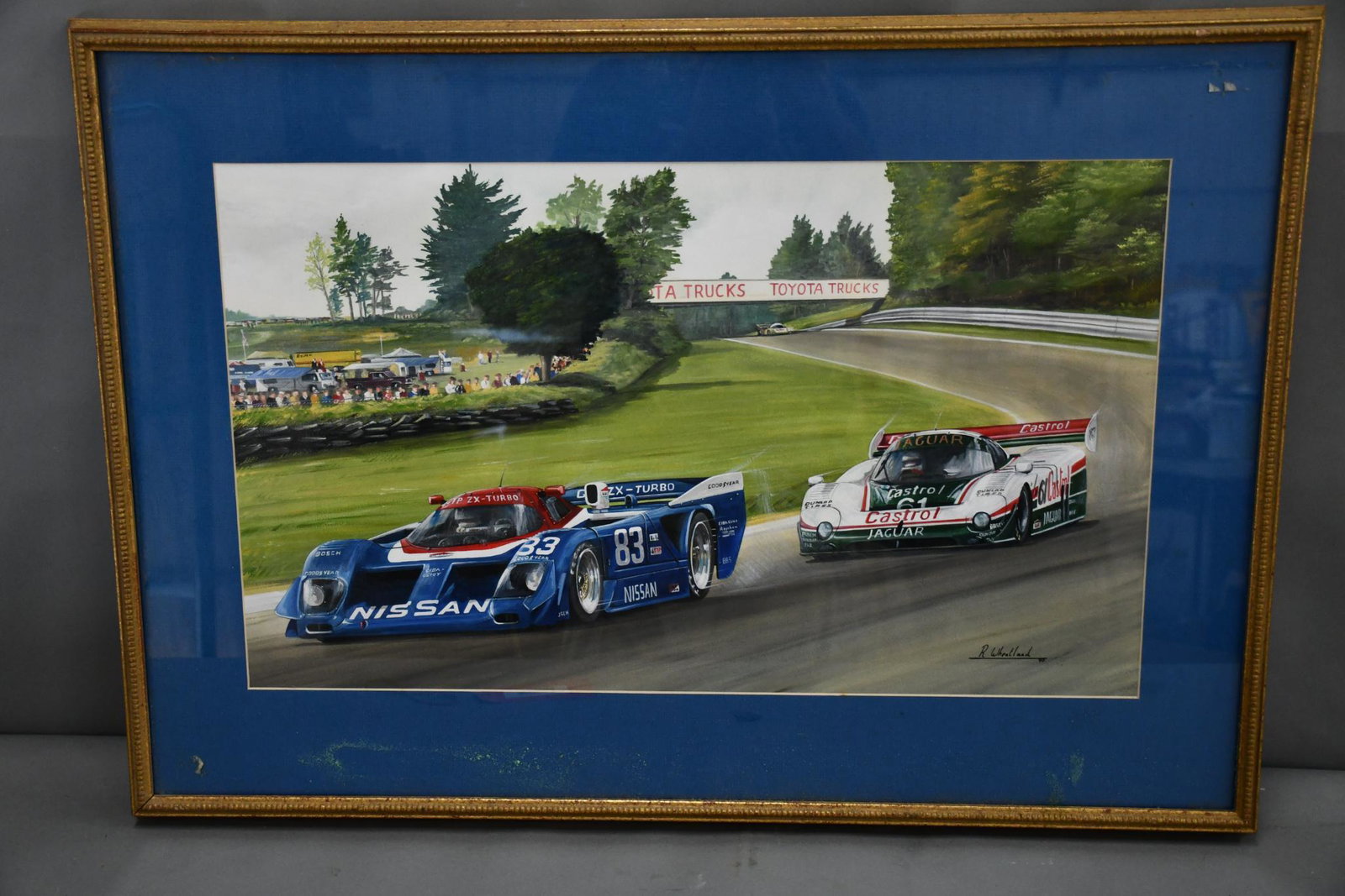 Formal 1 Race by Richard Wheatland: rated 9, 23"x32.5" frame, acrylic on board has very good color and condition, is signed and dated 1990 in the lower left-hand corner, is framed and matted under plexiglass.