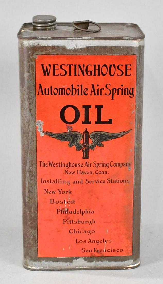 Westinghouse Automobile Air Spring Oil w/Logo One Gallon Square Metal Can: rated 7, the one gallon square metal can has soiling and wear, is empty, has lid.