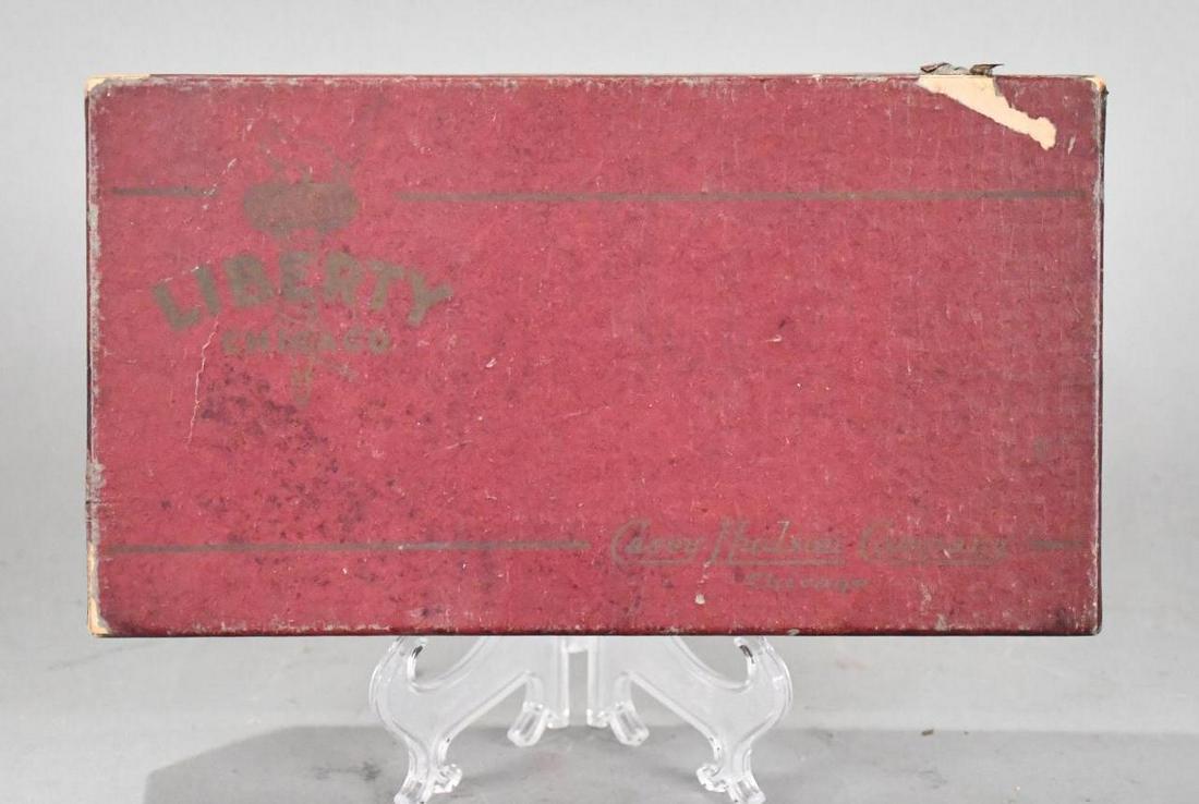 Liberty Spark Plug Set in Liberty Box: rated 8.25, 5"x9"x1.5", the cardboard box is marked Liberty Chicago on top, has light wear and scuffs, has 4-Liberty spark plugs inside, in excellent condition.