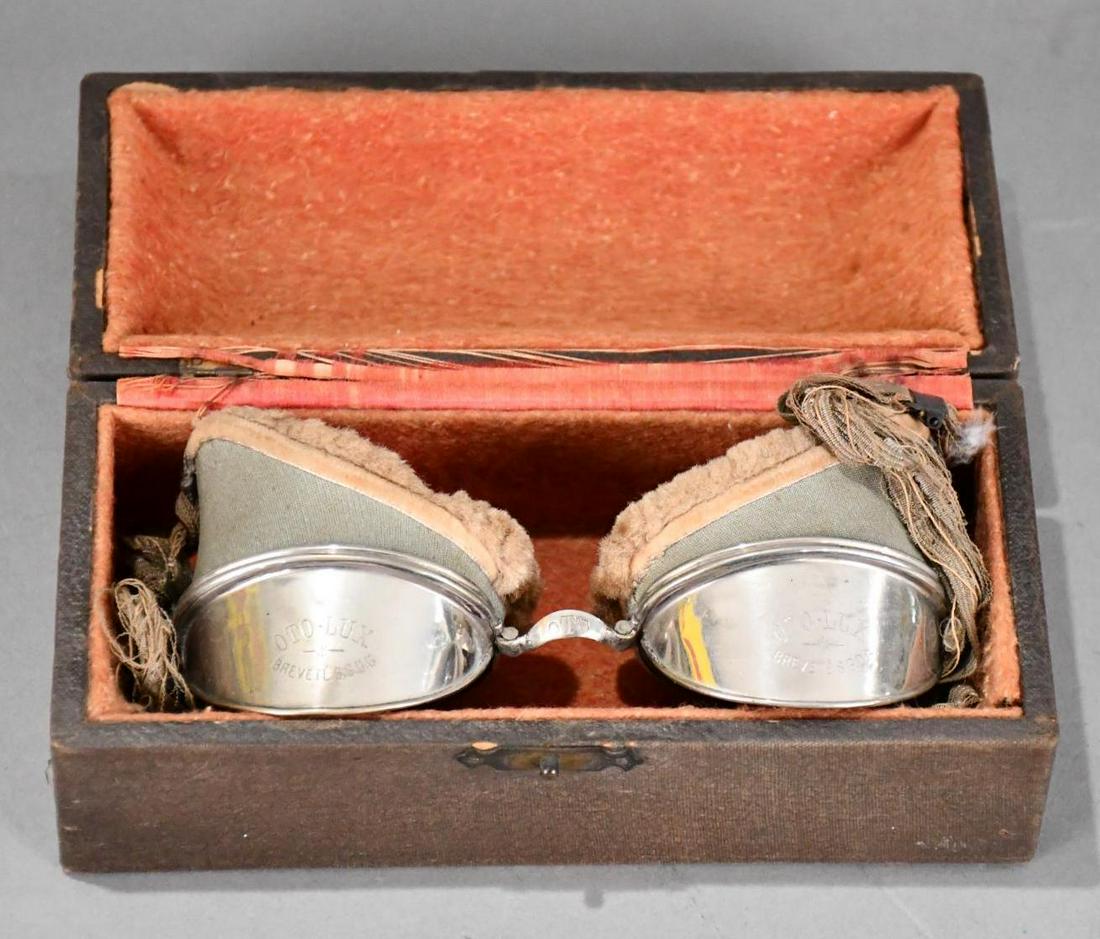 OTO-LUX Goggles in the Box: rated 9, 3"x7"x3", the box has wear and minor soiling, the goggles are in good condition, strape is not.