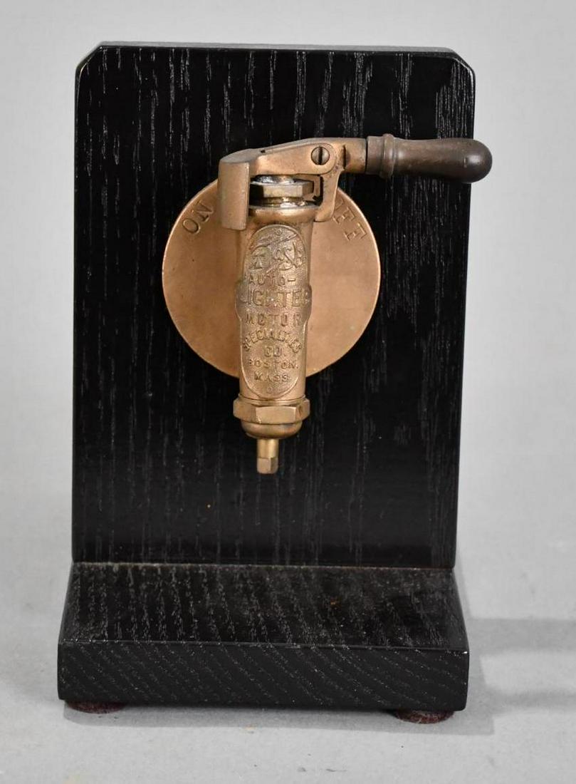 Auto Lighter Motor Specialties Counter Top Display: rated 9, 7"x5"x7", the brass auto lighter is mounted on a painted oak base, this piece is basically a key or switch for your vehicle. 