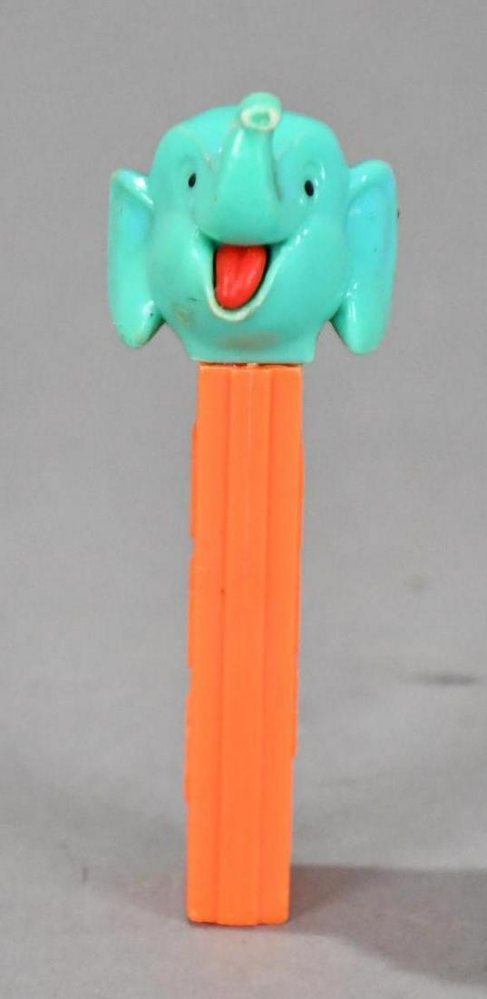 Pez Elephant on feet Dispenser: rated 9, 4.25"T., the plastic dispenser is in good condition, light wear.