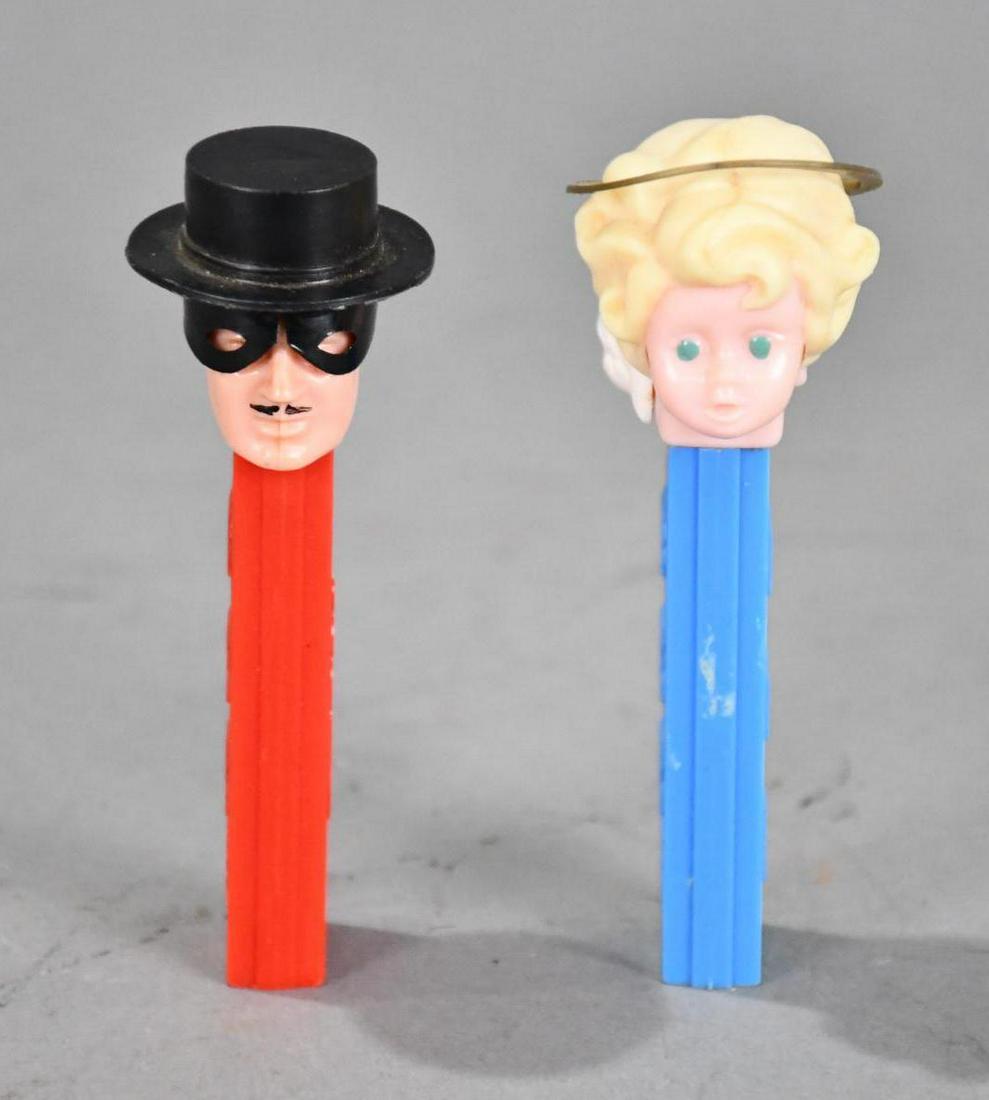 Pez Zoro & Angel no feet Dispensers: rated 8.75, & 9, 4"T., Zoro is good, Angel has a broken halo.