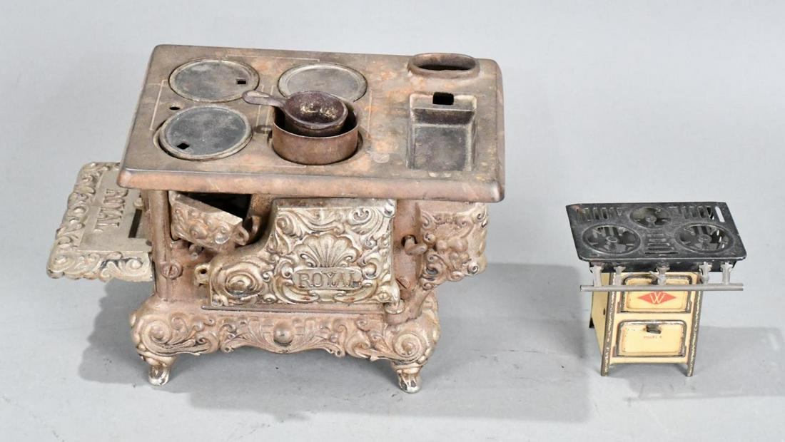 Child's Royal Cast Iron & Metal Stoves: 7"x11"x7", the cast iron stove is in good condition with no breaks, is missing a few small piece, the metal stove is good.