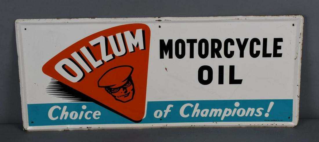 Oilzum Motorcycle Oil "Choice of Champions!" Metal Sign (TAC): rated 8.25, 15"x35.75", the SST self-framed sign has good color and shine, has dings, wear and scratches in the field and around the perimeter, marked A-M, dated 1966. TAC #047165