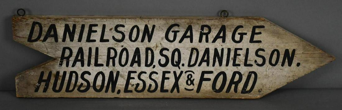 Danielson Garage Hudson, Essex & Ford Wood Arrow Sign: rated 7.5, 7"x27", the single-side arrow shaped sign has wear and soiling.