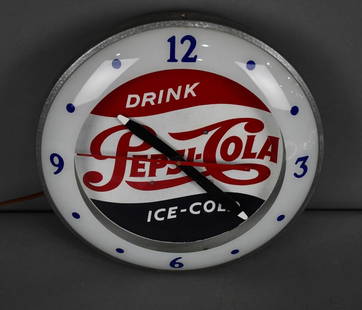 Drink Pepsi-Cola Ice-Cold Lighted Clock: rated 9, 14"D., the metal clock face and body are all in good condition, works.