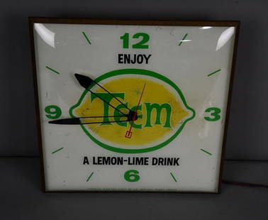 Enjoy Teem A Lemon-Lime Drink Lighted Clock: rated 8, 15"X15"x3.5", the clock face has minor wear, metal body is in good condition, has original Canadian Neon-Ray Clock decal on back with both doors, works.