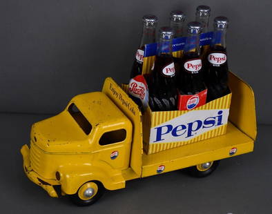 Minnitoy Pepsi-Cola Press Steel Delivery Truck: rated 7.75, 17.5"L., the press steel truck has good color and shine, has light wear.