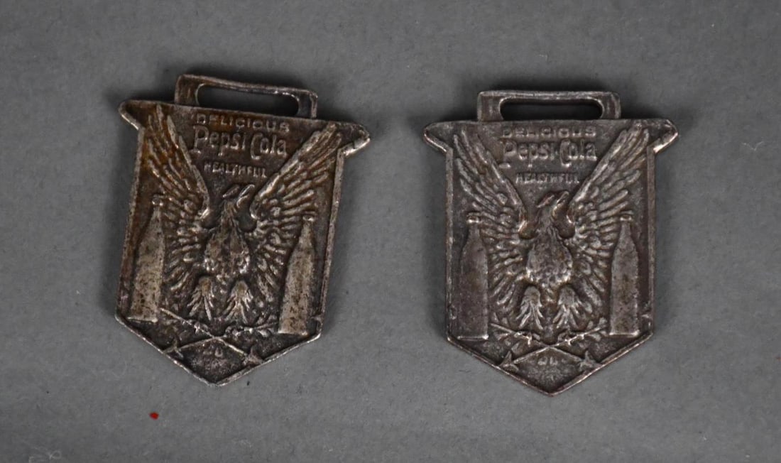 2-Pepsi-Cola Metal Watch Fobs: both in good condition with some wear.
