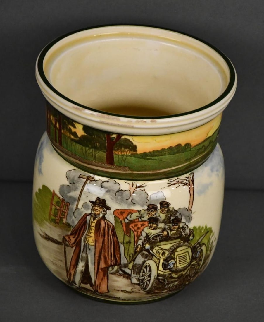 Royal Doulton "Motorist" Series "Deaf" Tobacco Humidor: rated 8, 7"T., the humidor is missing it's lid, has tiny flea bites around the rim, marked on bottom.