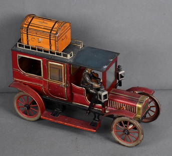 Large Carette Limousine Tin-Plate Key Wind Toy: rated 7, 12.5&#34;L., the tin-plate toy has good color and shine, has and fine scratches, has driver, no passengers, rubber tires are weathered, no key so we do not know if motor works.