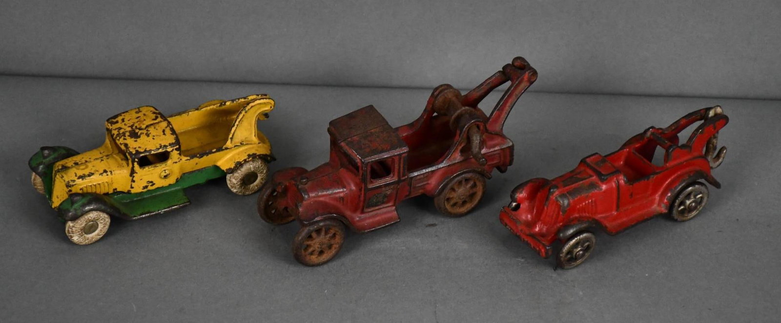 3-Cast Iron Wreckers: rated 6 to 7, 6"L. or less in size, there is Arcade, Hubley & Other.