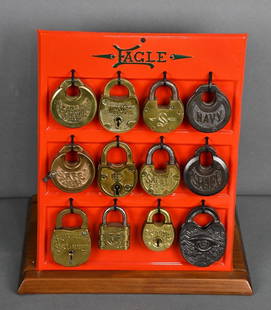 Eagle Padlock Counter-Top Point of Sale Metal Display: restored, 14"x12"x8", the metal back has been repainted, locks are attached with wire tires, mounted on a board.