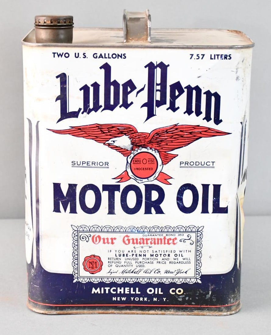 Lube-Penn Motor w/Eagle Logo Two-Gallon Metal Can: rated 7, the two-gallon metal can has wear and fine scratches, has dents in the corners, is empty.