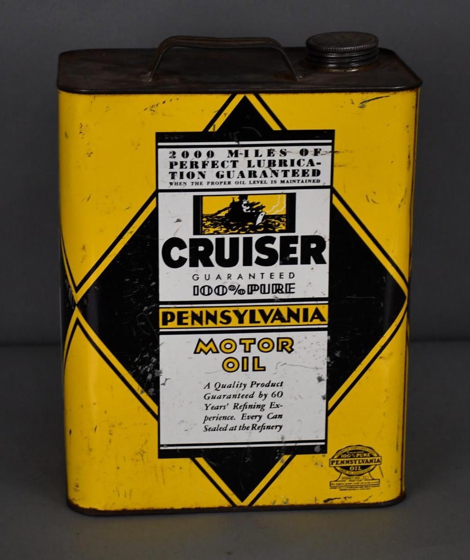 Cruiser Motor Oil w/small Navy Cruiser Ship Image Two-Gallon Metal Can: rated 7.5, the two-gallon rectangle metal can has wear, fine scratches and dings, is empty.