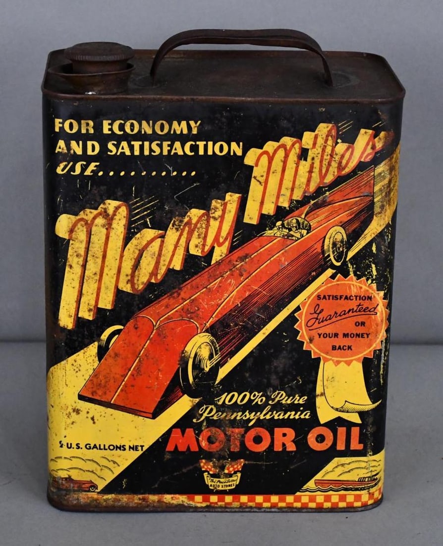 Many Miles w/Race Car Image Two-Gallon Metal Can: rated 6.5, the two-gallon rectangle metal can has wear, rust staining and dents, is empty.