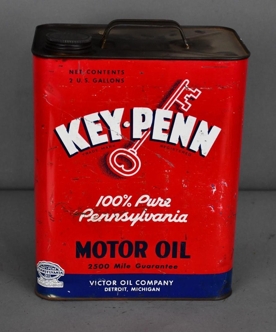 Key-Penn Motor Oil Two-Gallon Metal Can: rated 7, the two-gallon rectangle metal can, has wear, scratches and dings, is empty.