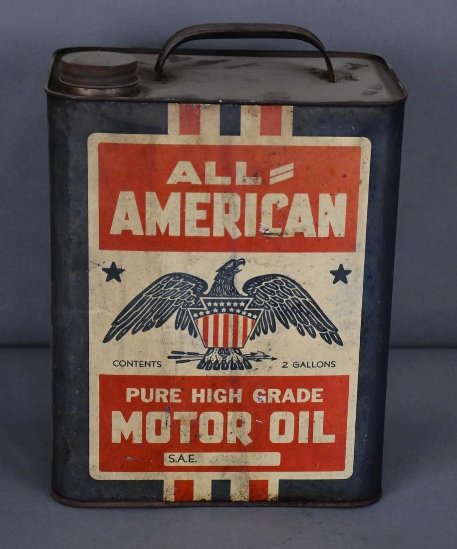 All-American High Grade Motor Oil w/Eagle Logo Two-Gallon Metal Can: rated 7 & 6.5, the two-gallon rectangle metal can display is soiled, reverse has wear, is empty.