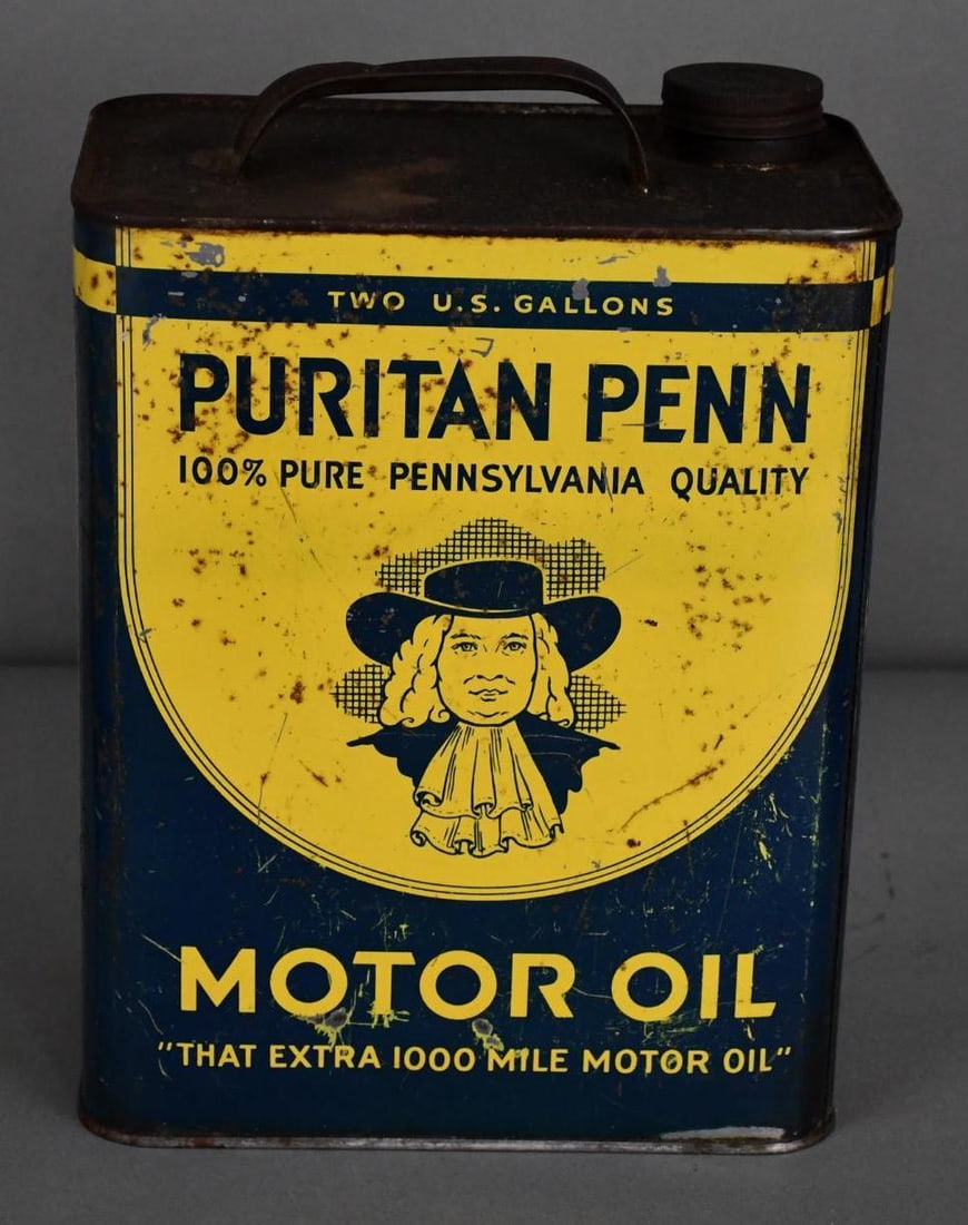 Puritan Penn Motor Oil w/Logo Two-Gallon Metal Can: rated 7 & 3, the two-gallon rectangle metal can has wear, fine scratches and soiling, reverse has heavy staining and wear, is empty.