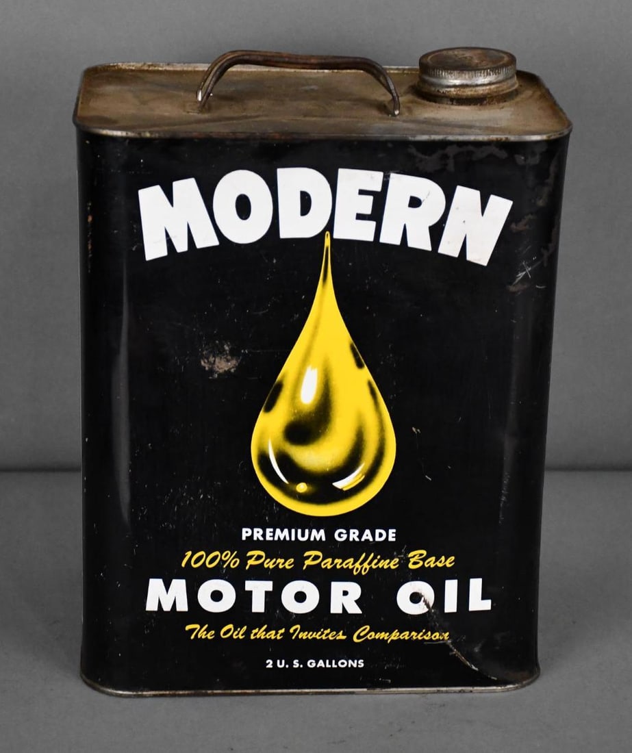 Modern Motor Oil w/Logo Two-Gallon Metal Can: rated 7.5, the two-gallon rectangle metal can has light wear, scratches and dings, is empty.