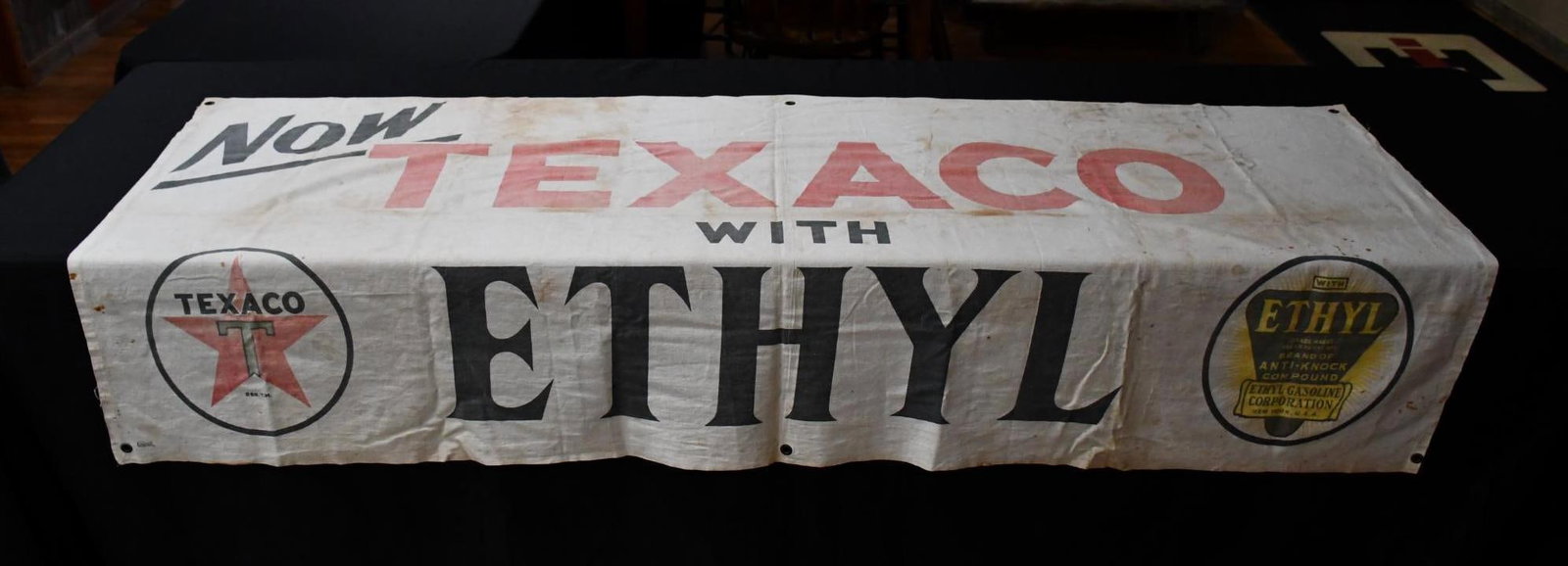 Now Texaco with Ethyl Cloth Banner: rated 7, 34"x74", the cloth banner has wear and is faded.