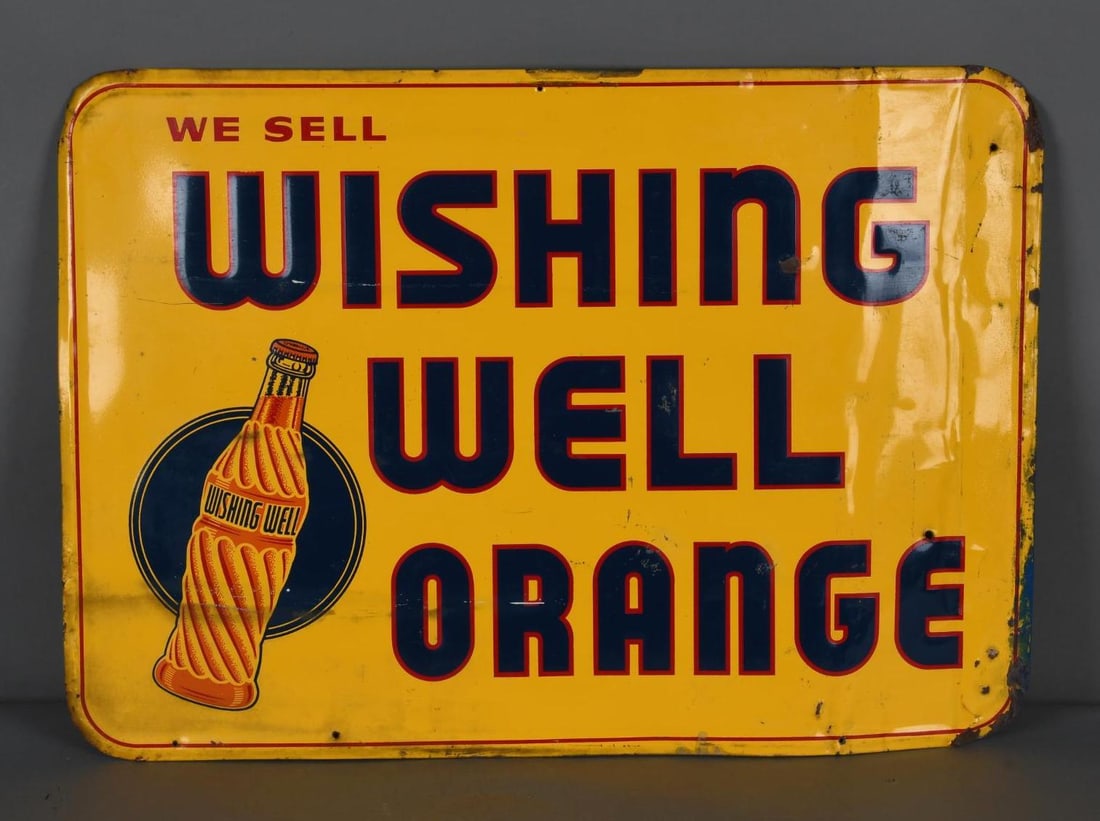 We Sell Wishing Well Orange w/Bottle Logo Metal Sign (TAC): rated 7, 19.25"x27.25", the SST embossed sign has good color and shine, has wear and fine scratches in the field, has vertical crease in the right hand field. TAC #044059