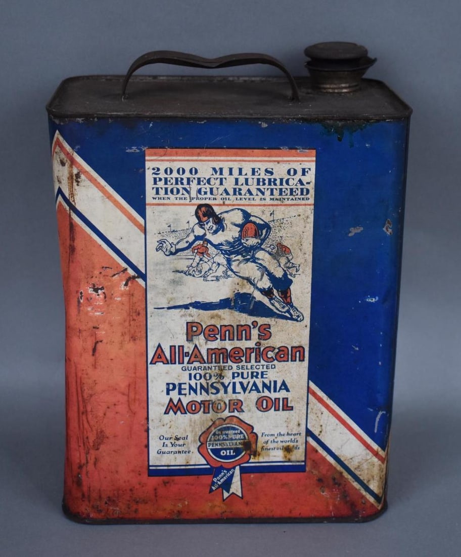Penn's All-American Motor Oil w/Football Player Two-Gallon Metal Can: rated 6.75, the two-gallon rectangle metal can has wear, scuffs and dings, is empty.